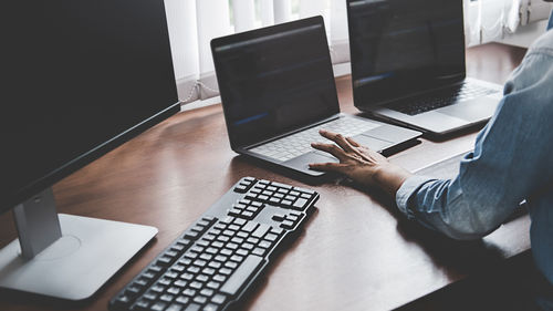 High angle view of man using laptop on table