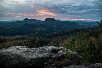 Scenic view of mountains against sky at sunset
