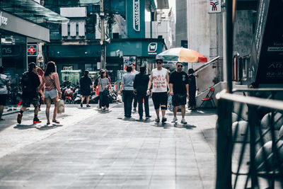People walking on city street
