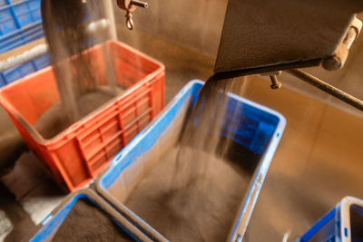 Filling plastic boxes with tea. producing process in tea factory in sri lanka.