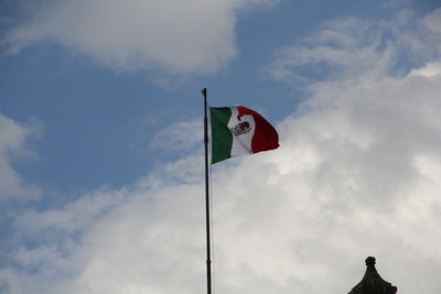 Low angle view of flag against sky