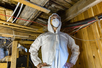 Low angle view of person standing on ceiling