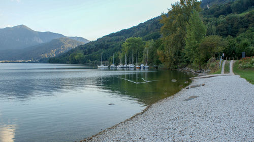 Scenic view of lake and mountains against sky