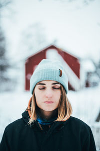 Portrait of young woman in snow