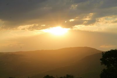 Scenic view of mountains against sky during sunset