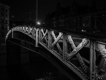 Illuminated bridge at night