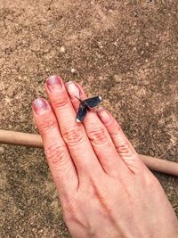 Close-up of hand holding metal