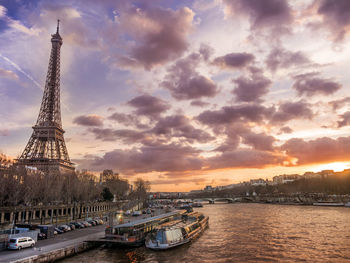 Eiffel tower against cloudy sky