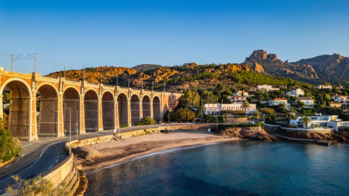 Bridge over river against clear sky