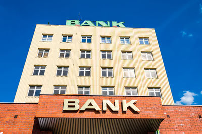 Low angle view of building against blue sky