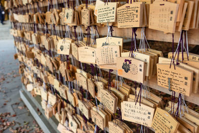 High angle view of text hanging on wood