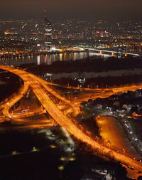 High angle view of light trails in city at night
