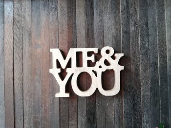 Directly above shot of text on wooden table
