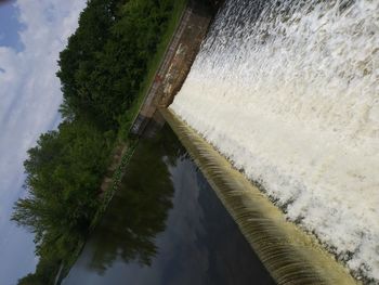 High angle view of dam by river against sky