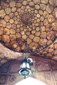 Low angle view of chandelier hanging from ceiling