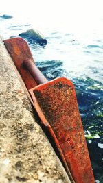 Close-up of rusty ship in sea