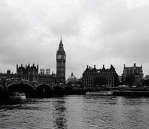 Bridge over river with city in background