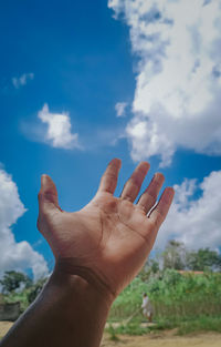 Midsection of person against sky