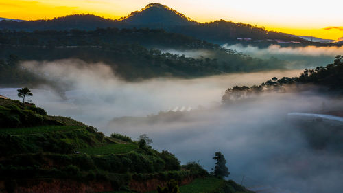 Scenic view of mountains against sky during sunset