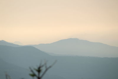 Scenic view of mountains against sky during sunset