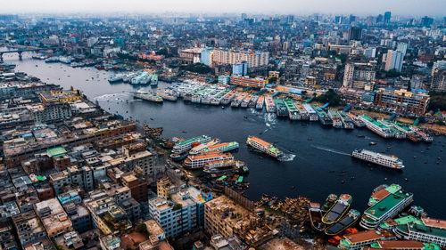 High angle view of river amidst buildings in city