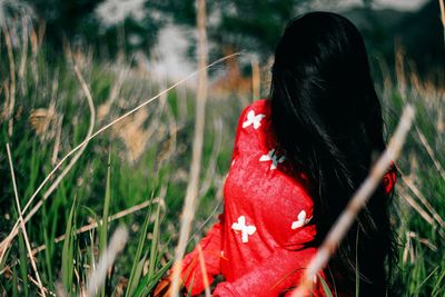 Woman looking away on field