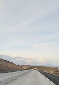 Empty road against sky