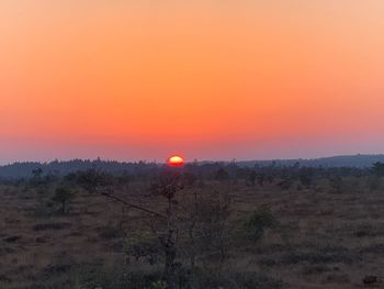 Scenic view of landscape against sky during sunset