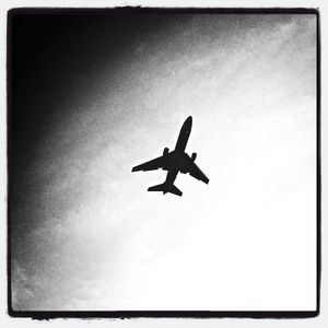 Low angle view of airplane flying in sky