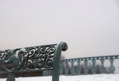 Close-up of railing against sea