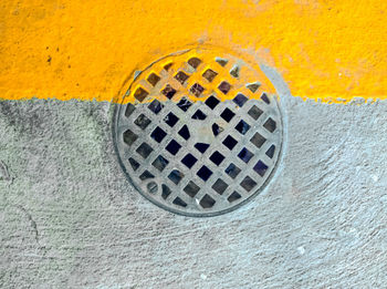 Directly above shot of manhole on footpath