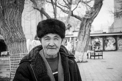 Portrait of smiling man in city