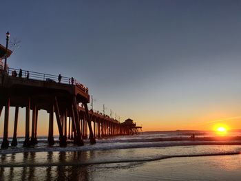 Scenic view of sea against clear sky during sunset