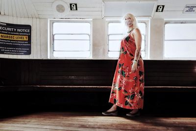 Full length of woman standing on floor