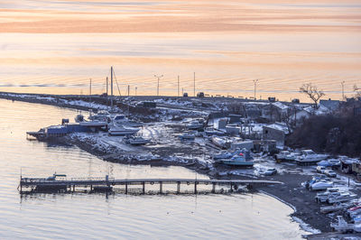 High angle view of sailboats moored at sea against sky