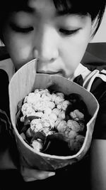 Close-up portrait of boy with ice cream in bowl