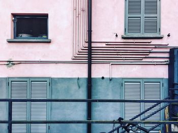 Low angle view of closed window of old building