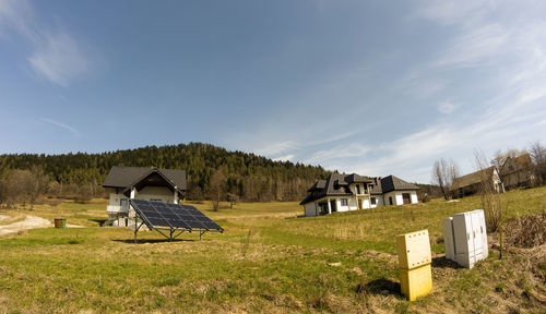  wide angle shot of an a shaped houses and solar energy panel photovoltaic panels pv. 