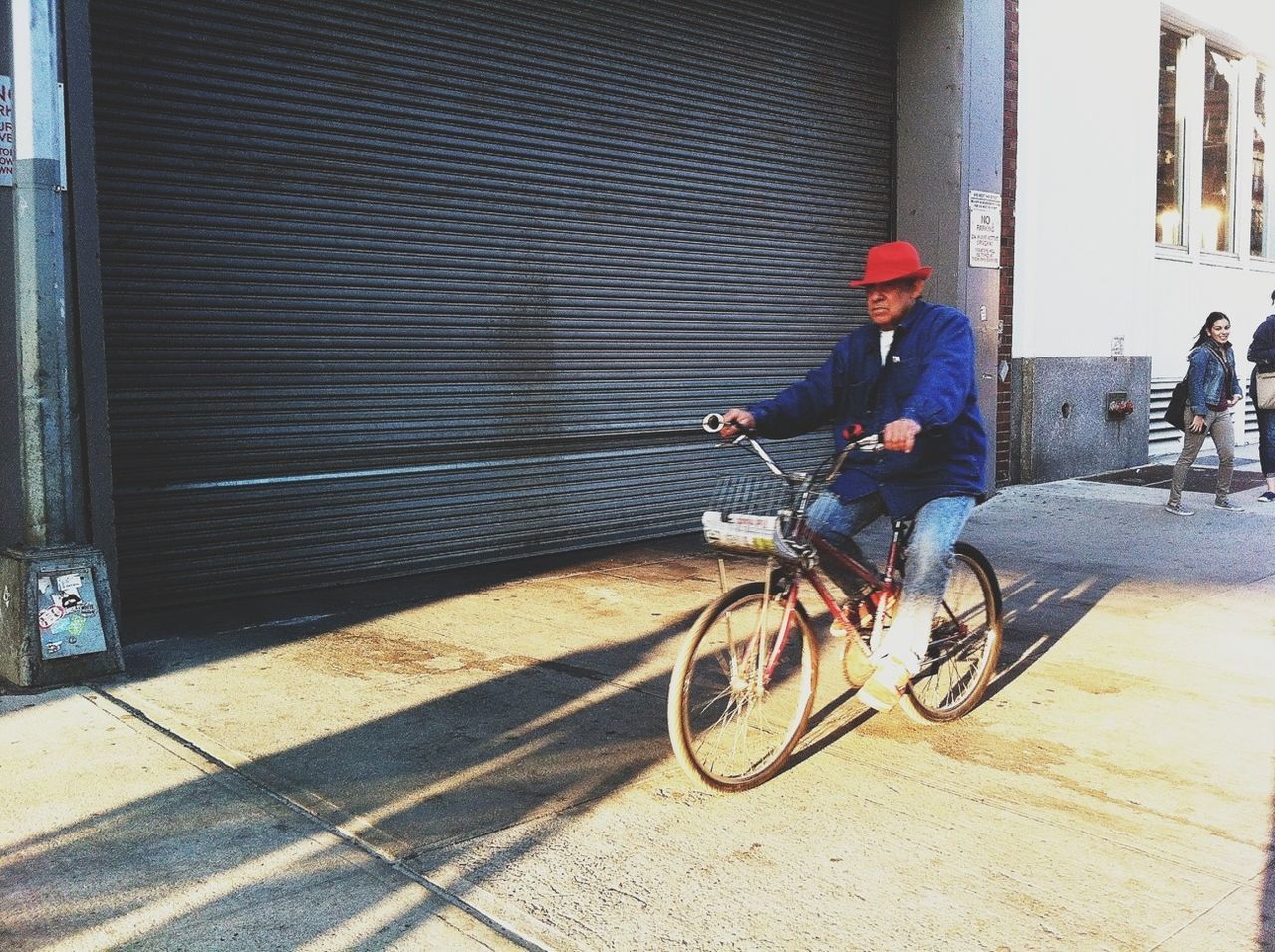 bicycle, transportation, land vehicle, mode of transport, street, building exterior, architecture, stationary, built structure, sidewalk, parking, parked, city, riding, men, road, wall - building feature, day