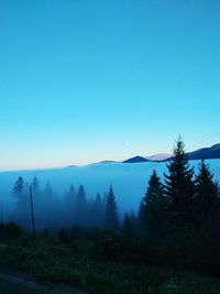 Scenic view of mountains against clear blue sky