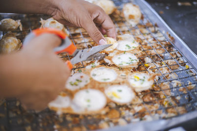 Close-up of person preparing food