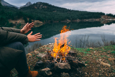 Reflection of man on water in lake