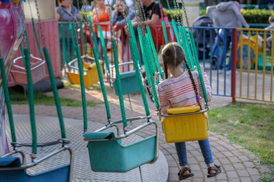 Rear view of woman in playground