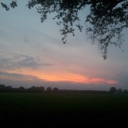 Scenic view of landscape against sky at sunset