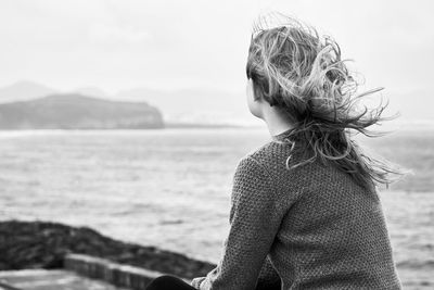 Rear view of woman looking at sea