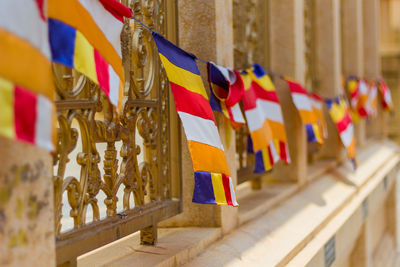 Multi colored flags hanging in row