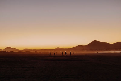 Scenic view of sea against clear sky during sunset