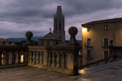 Exterior of historic building against sky at dusk