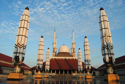 Low angle view of mosque against sky in city