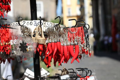 Close-up of bicycle hanging on street in city